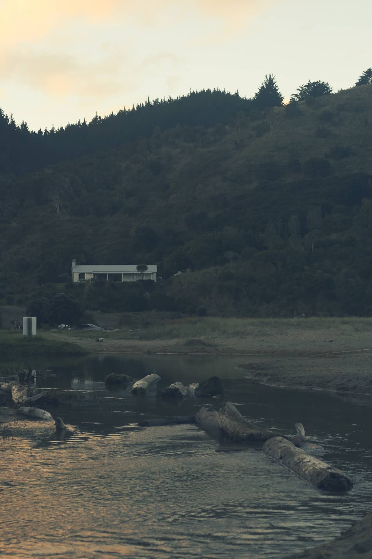Photo of a house across a body of water.