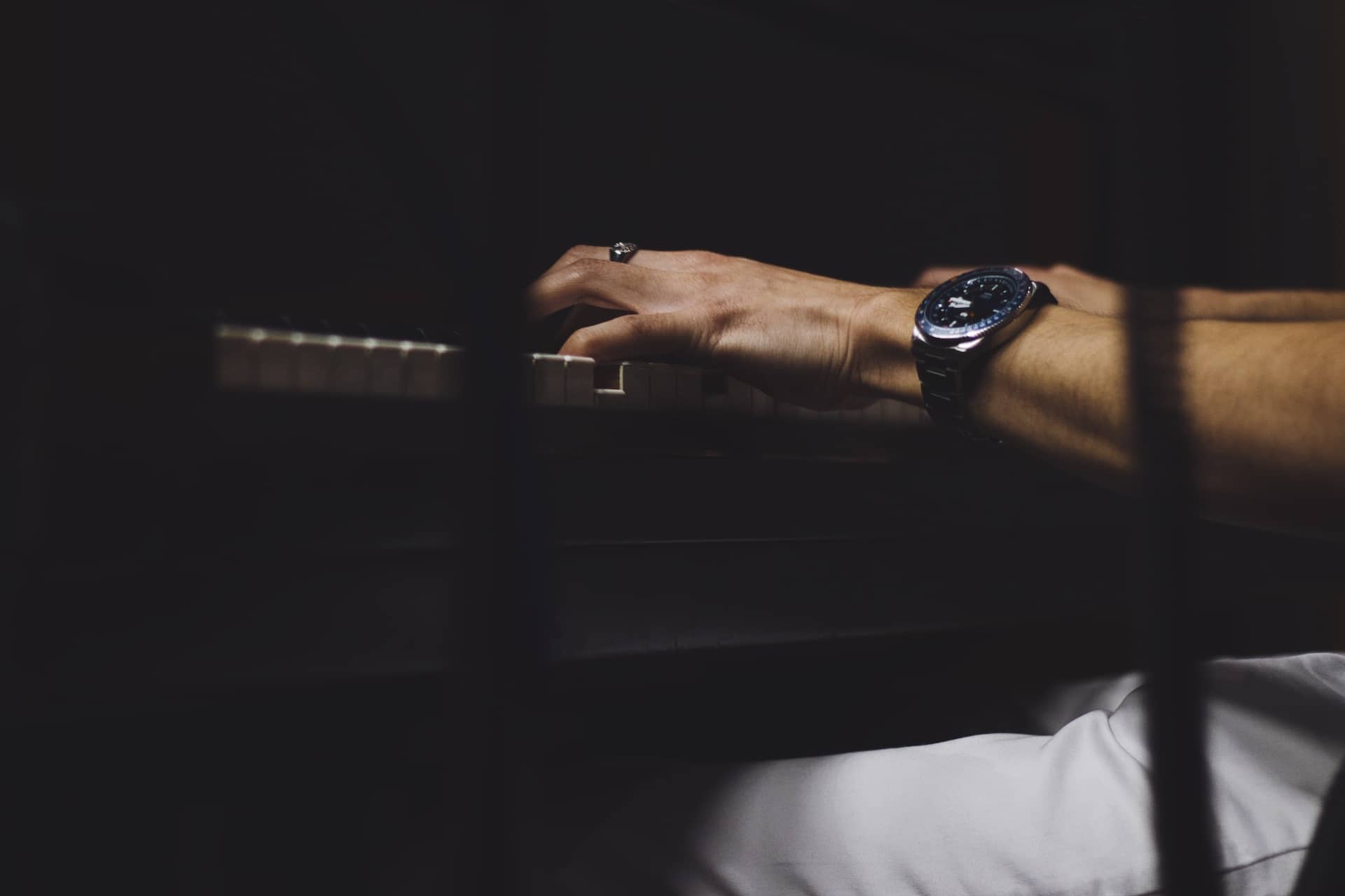 Photo of a piano being played.